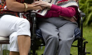 An elderly person with their carer